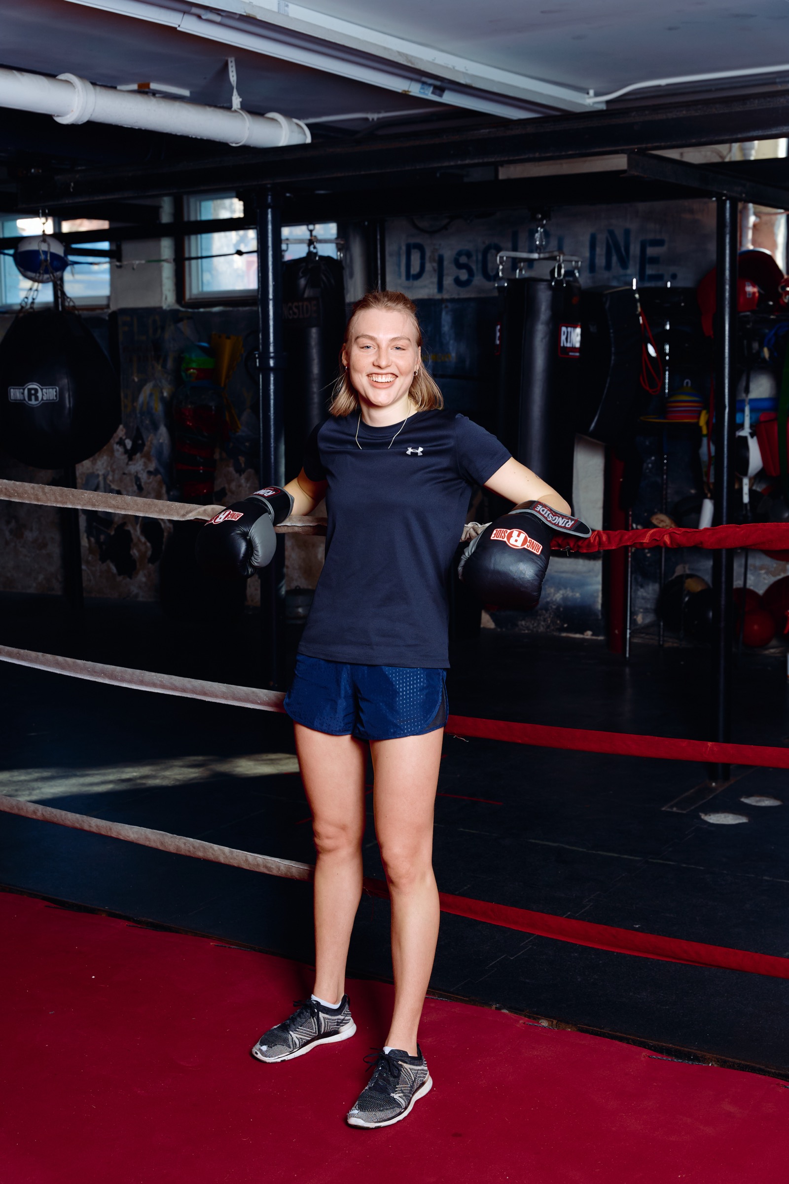 Woman standing in the boxing ring